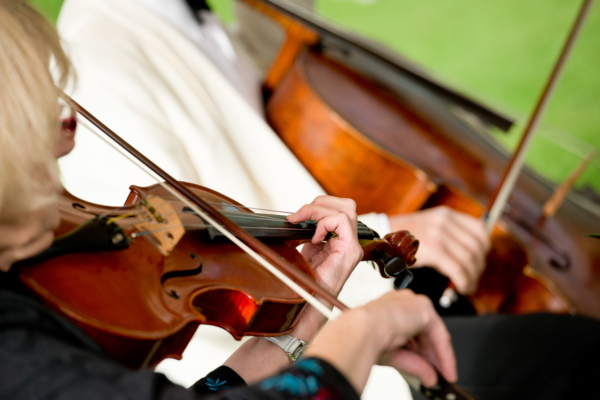 Violin and cello playing at a wedding ceremony