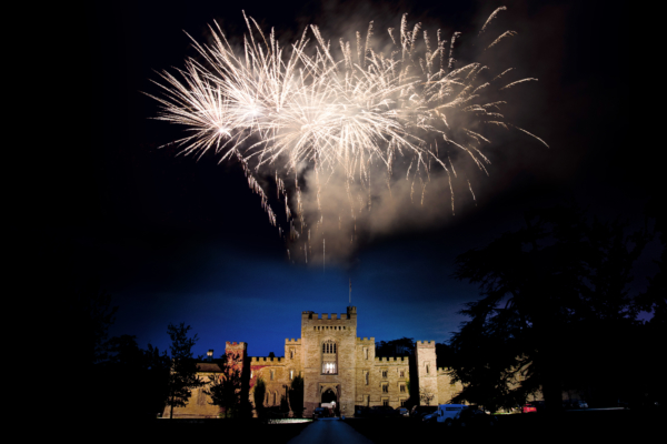Wedding celebration fireworks exploding over Hampton Court Castle.