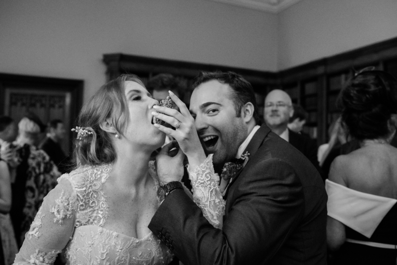 Black and white photo of couple eating oysters.