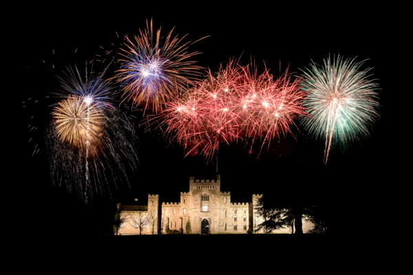 Fireworks exploding above a castle