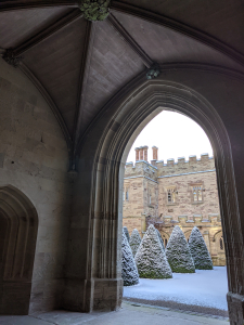 Archway to snowy evergreens