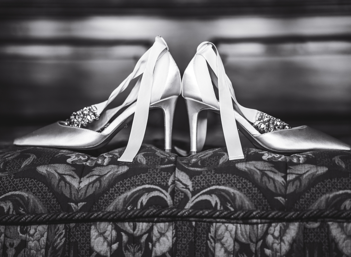 Black and white photo of bride's shoes