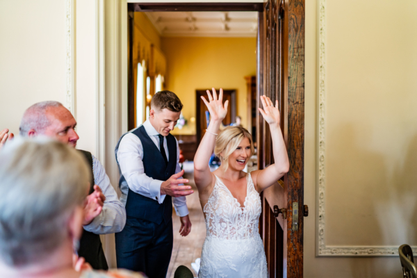 Bride and groom enter the ballroom