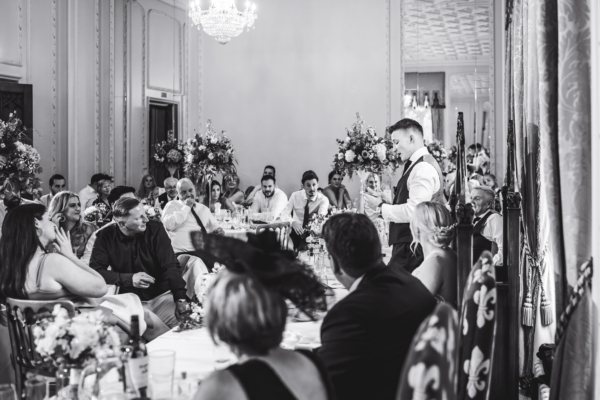 Wedding reception with groom giving speech
