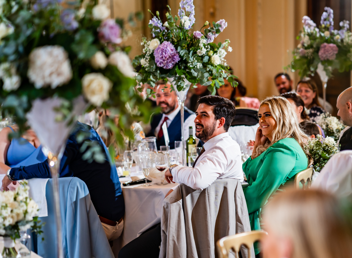 Wedding guests look on during speeches