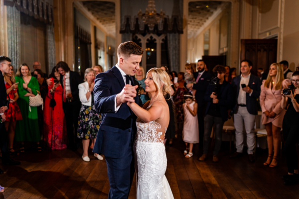 Couple have their first dance in the ballroom