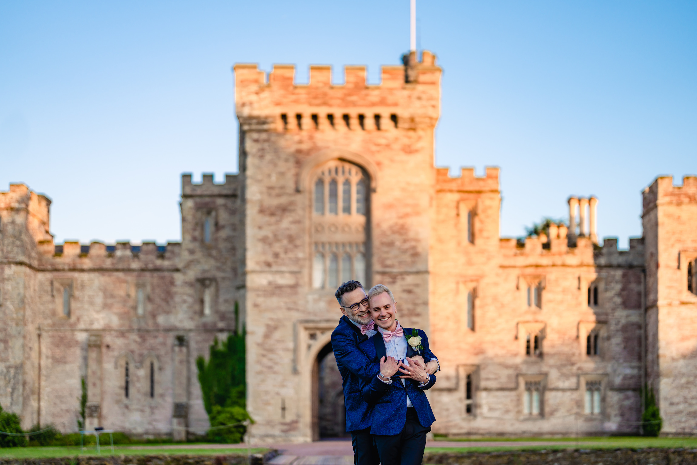 grooms in front of the Castle at Hampton Court Castle wedding