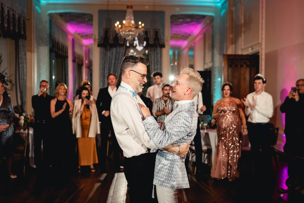 grooms dancing on dancefloor at Hampton Court Castle wedding