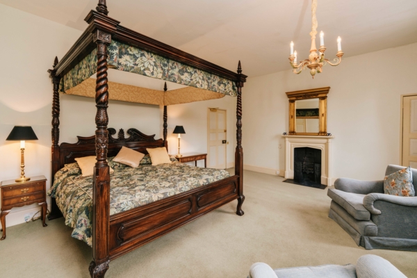 Fourposter bed in ornate formal room